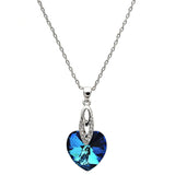 Silver chain necklace featuring a shimmering deep blue heart-shaped crystal pendant, feminine and romantic.