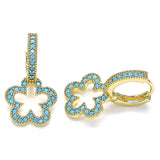 Delicate gold drop earrings featuring open flower silhouettes encrusted with small turquoise blue crystals, blending boho charm with sparkle.