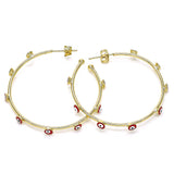 Chic gold evil eye hoop earrings with smooth, minimalist design perfect for daily wear or layering with other hoops.
