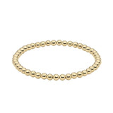 Minimalist gold stretch bracelet with polished round beads, perfect for everyday wear or stacking with layered accessories.
