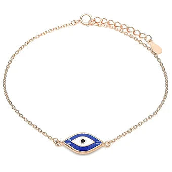 Dainty rose gold chain bracelet with a blue evil eye charm, perfect for protection and layering.