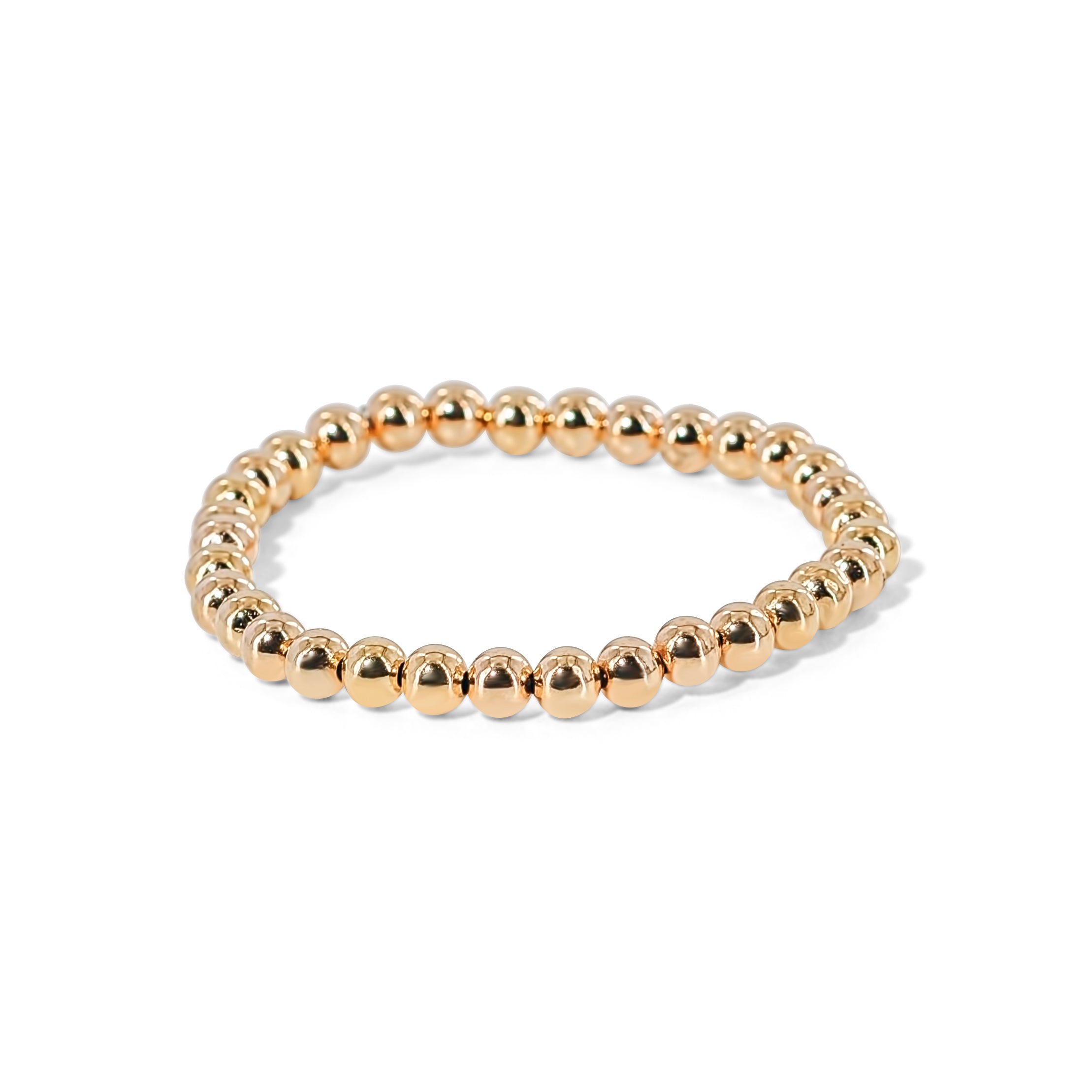 Gold tone stretch bracelet with with a stretch fit, perfect for layering or minimalist wear.