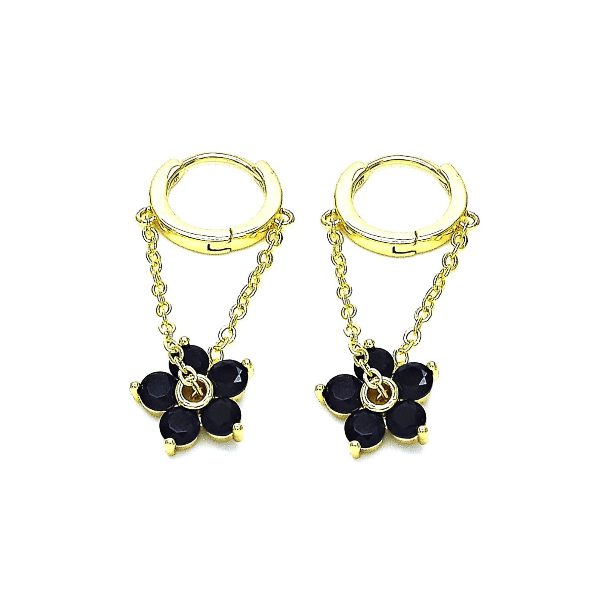 gold dangle flower earrings black flower gemstones on white background