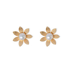 Textured gold flower stud earrings featuring radiant faux pearl centers, blending natural elegance with vintage charm.