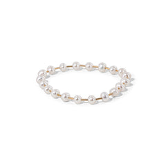Stretch ring made of glossy faux pearls, timeless and easy to stack or wear solo.