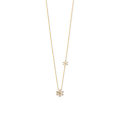 GoldTone_SterlingSilverChainDelicateFlowerPendant.jpg: Jewelry piece on a clean white background